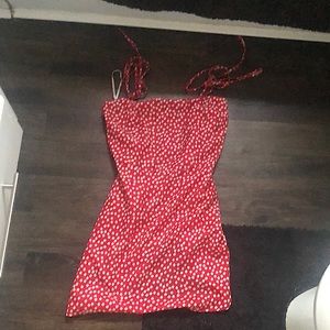 It a red flower dress with adjustable straps